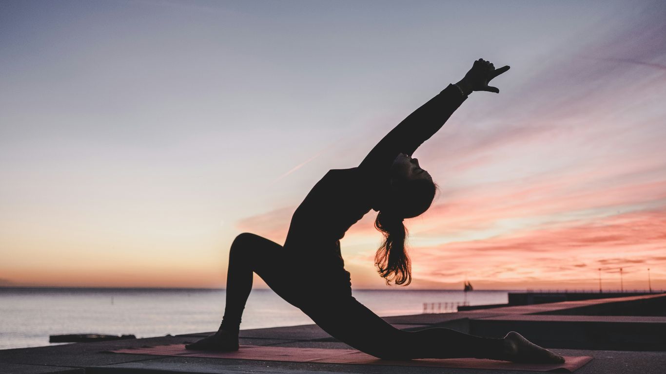 Practicing balance with a colorful yoga block