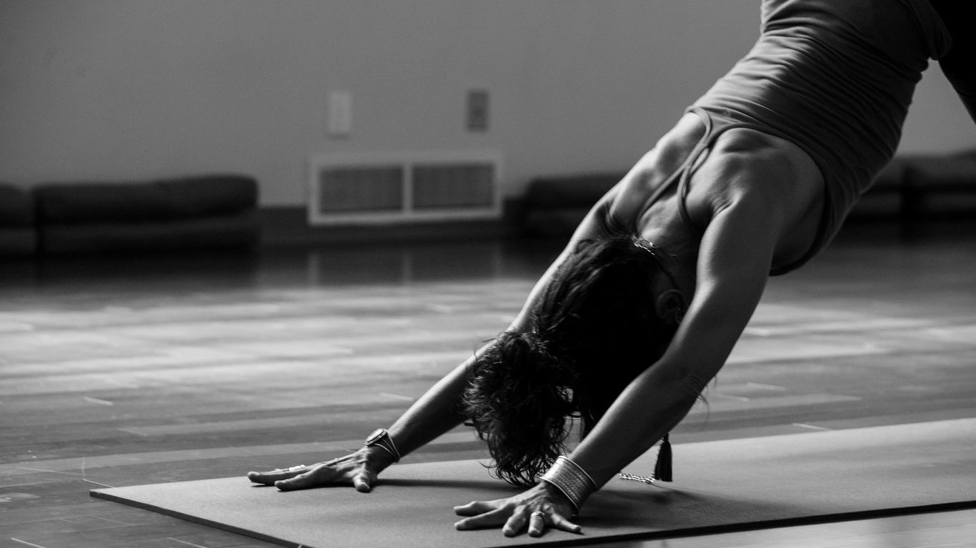 Yoga student practicing downward dog pose